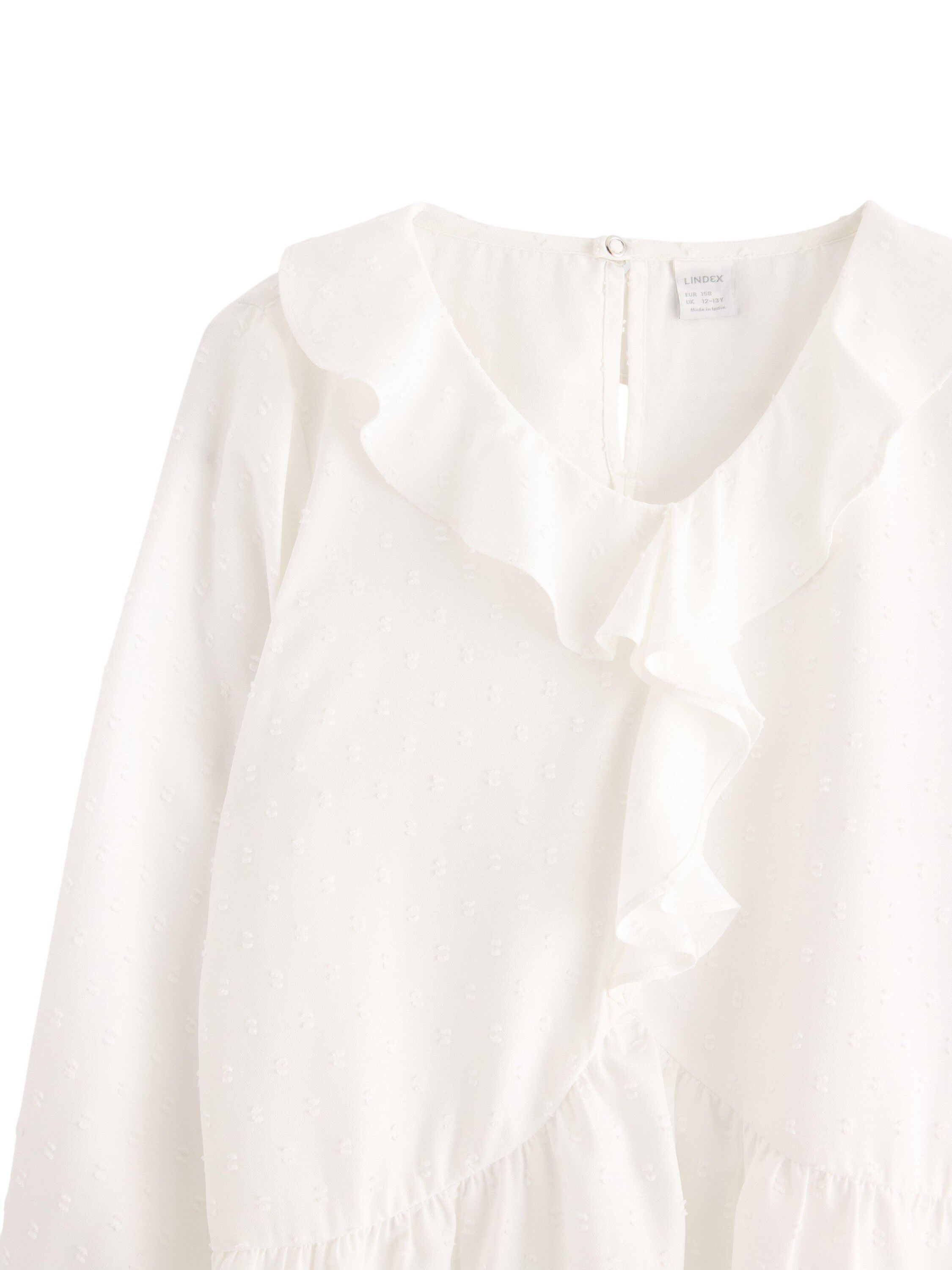 Blouse with flounce at front