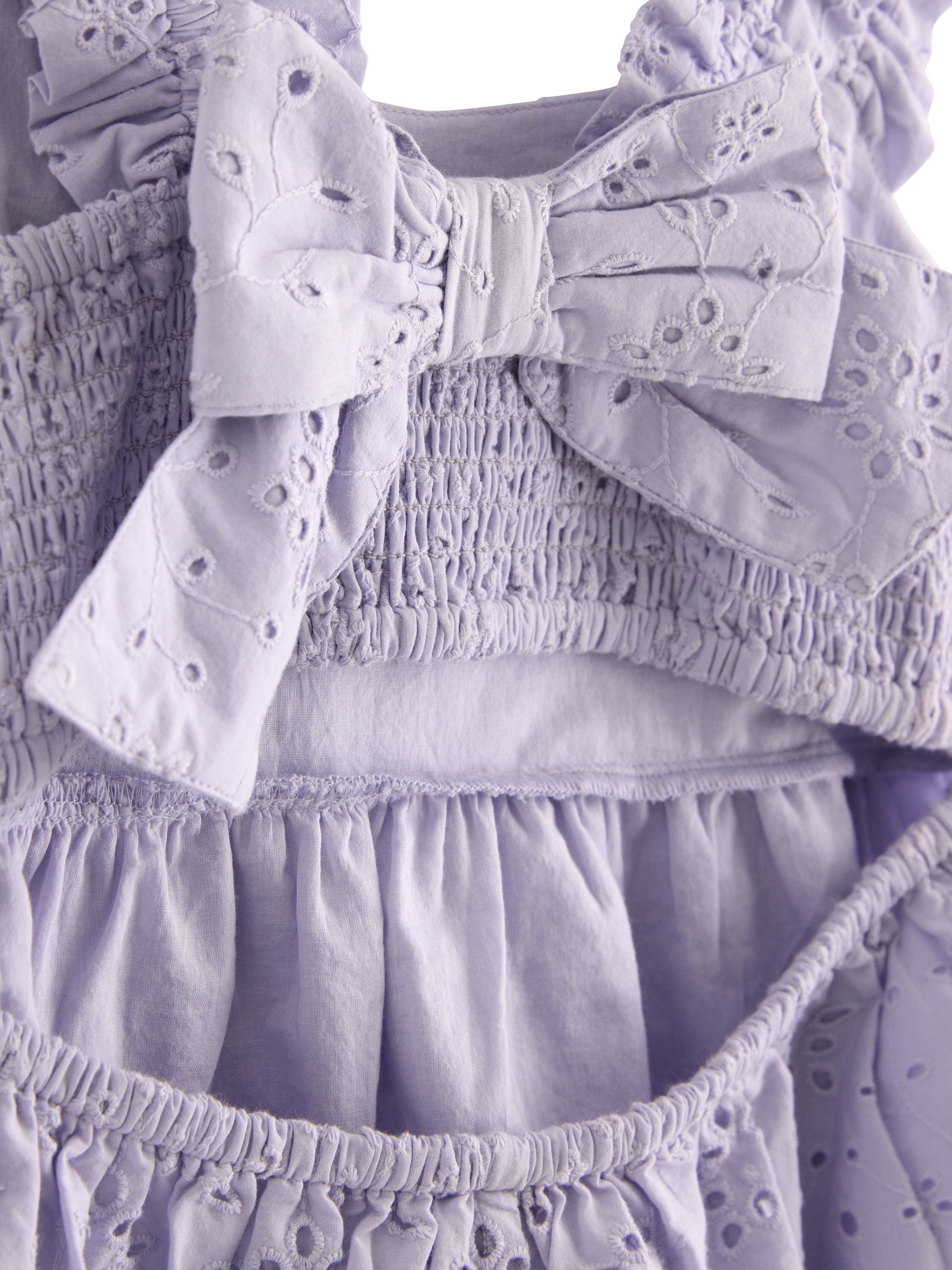 Sleeveless blouse with broderie ang