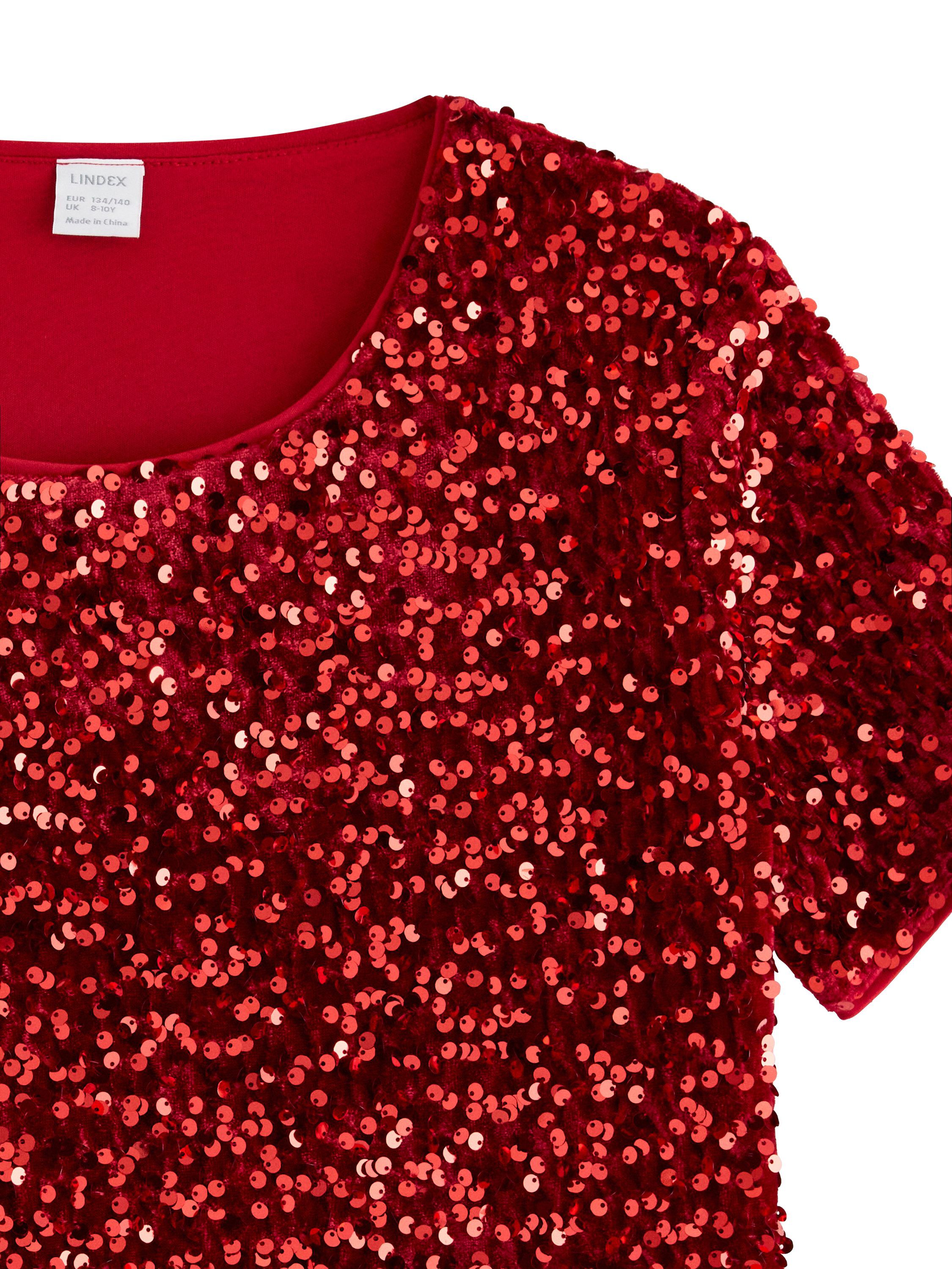 Glitrende kortermet topp med fl&oslash;yel