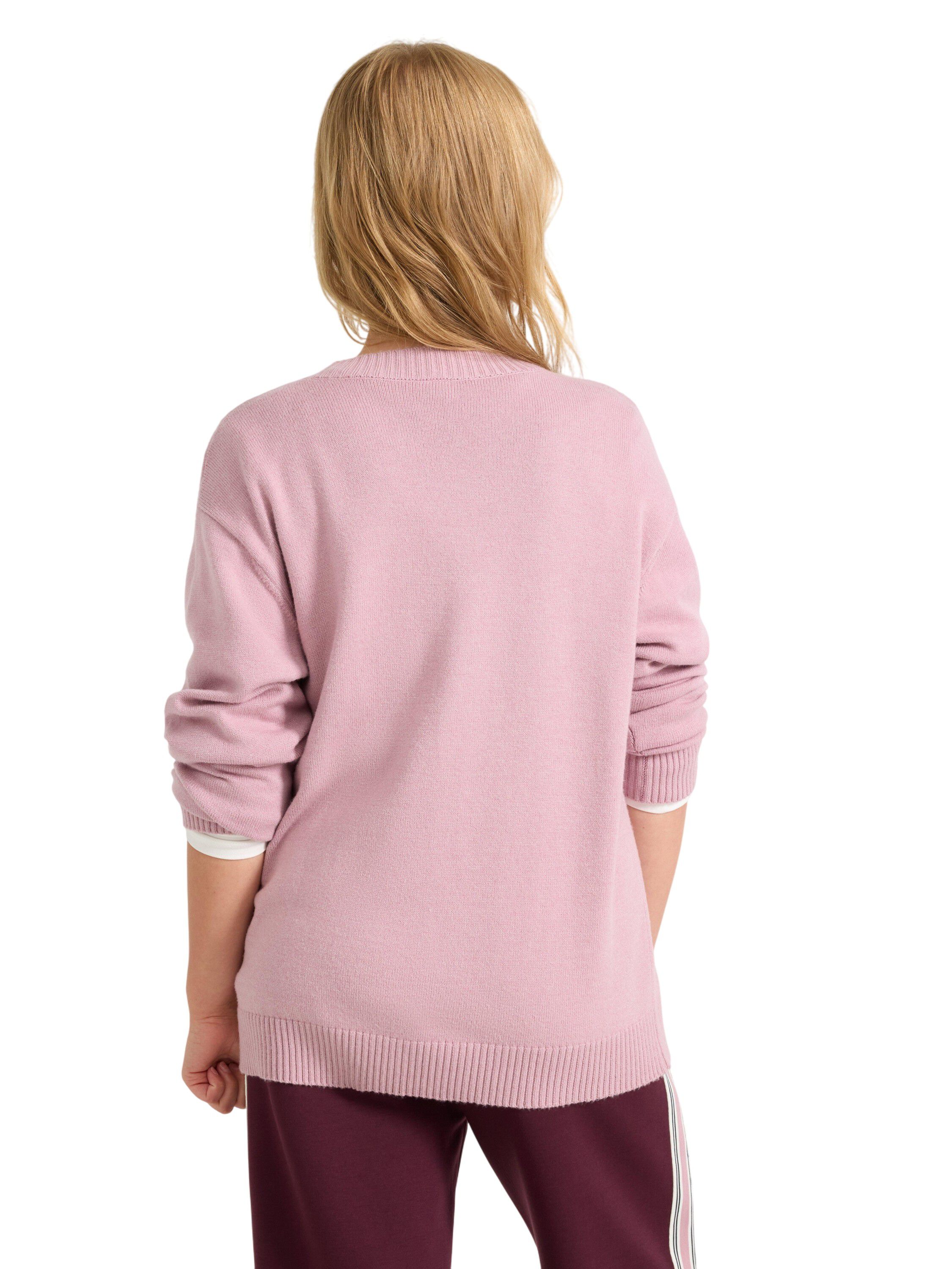 Sweater knitted placement inta