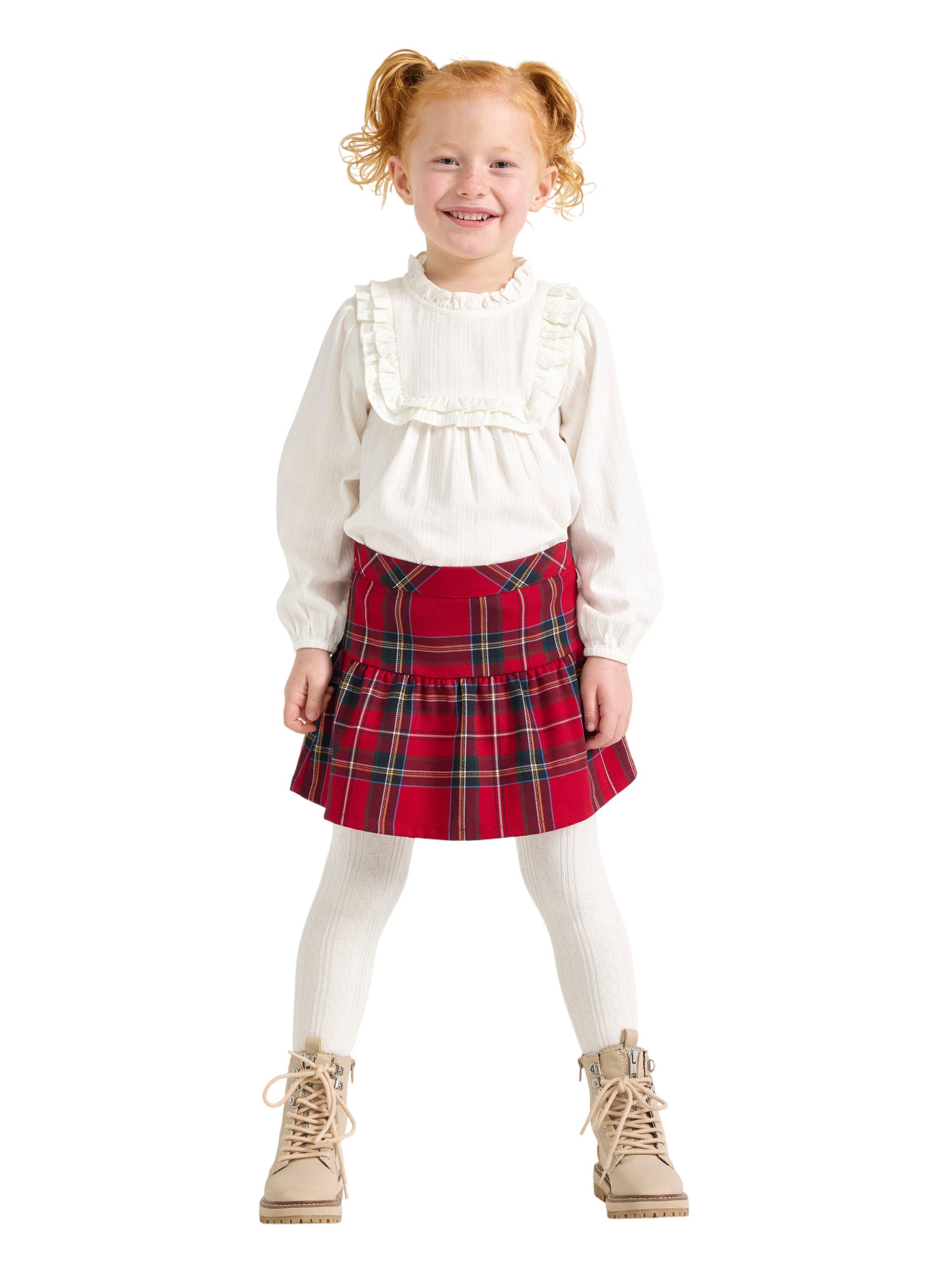 Rutig kjol med res&aring;r i midjan och d