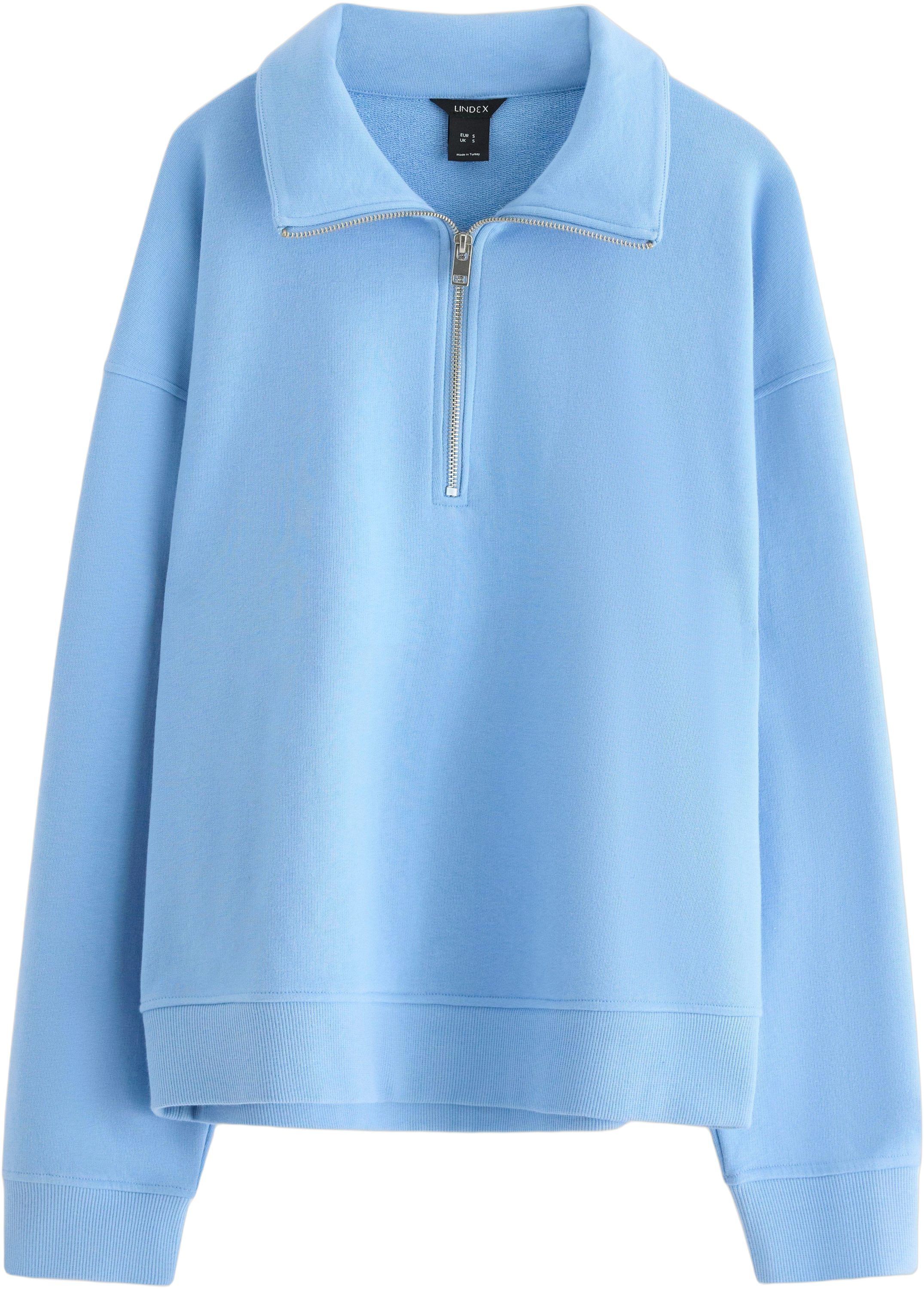 Mjuk sweatshirt med half zip och av