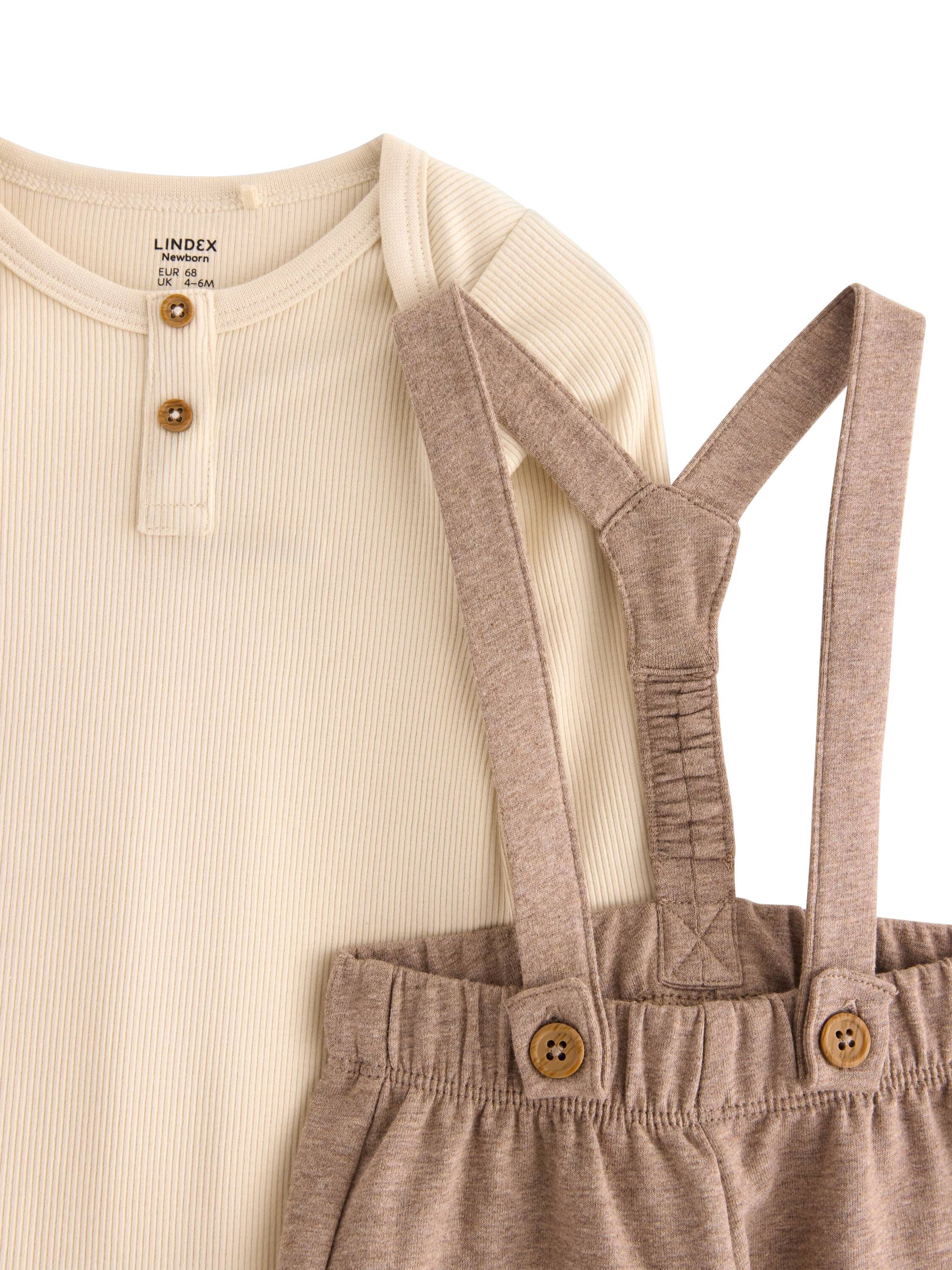 Bl&oslash;dt s&aelig;t i bomuld med en lang&aelig;rmet