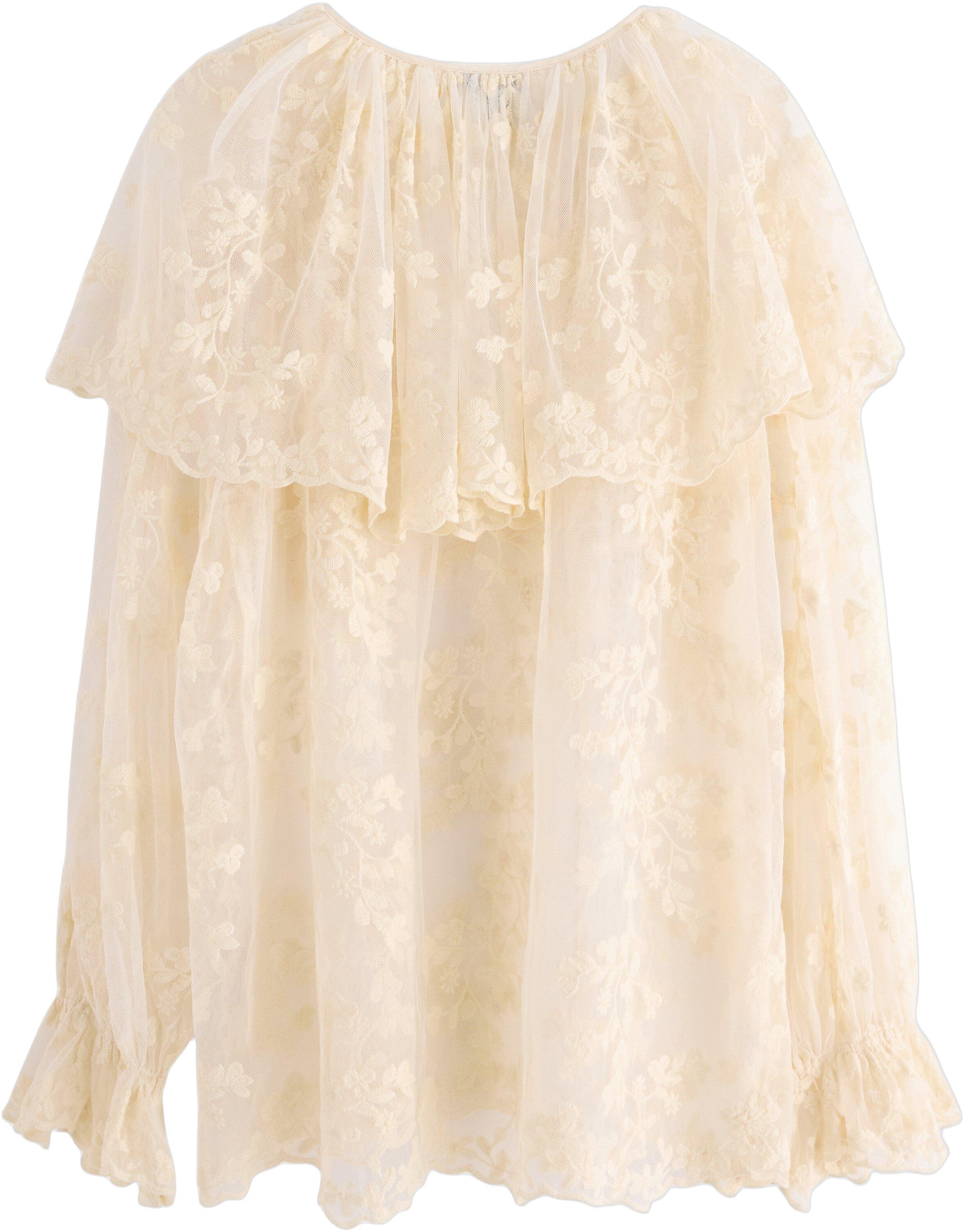 Sleeveless blouse in lace and mesh.