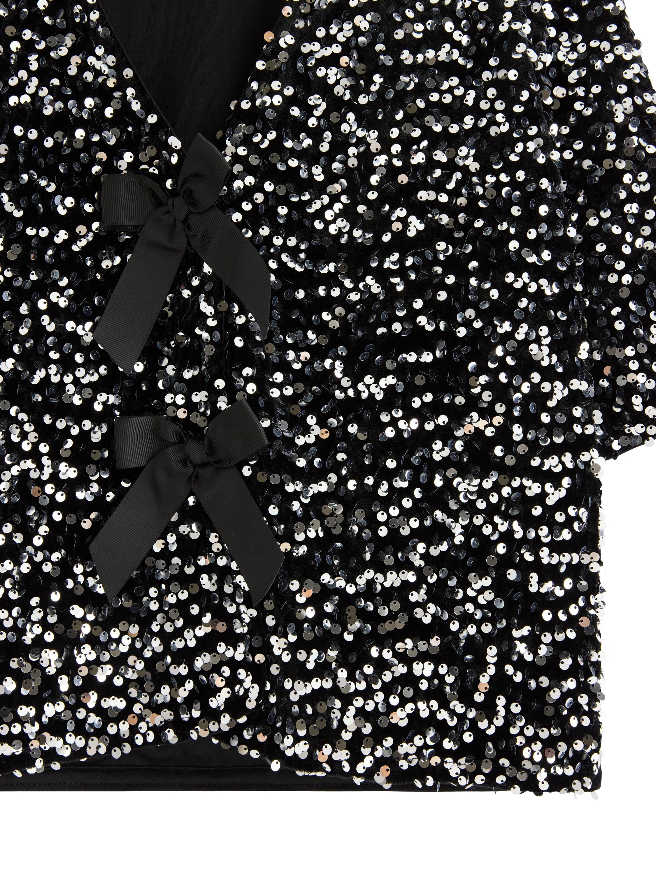 Kort&auml;rmad topp med paljetter och ro