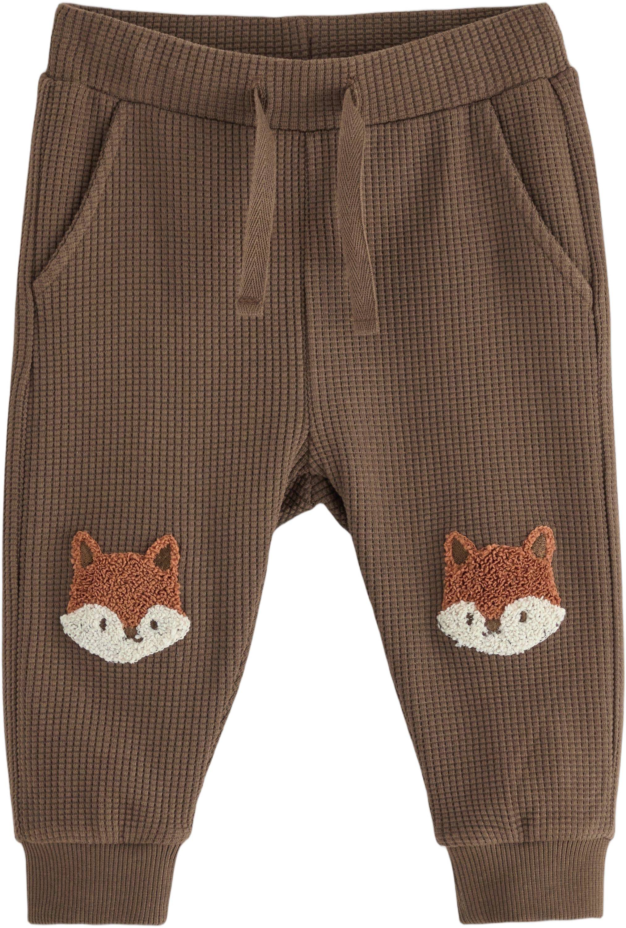 Joggers in waffled cotton with appl