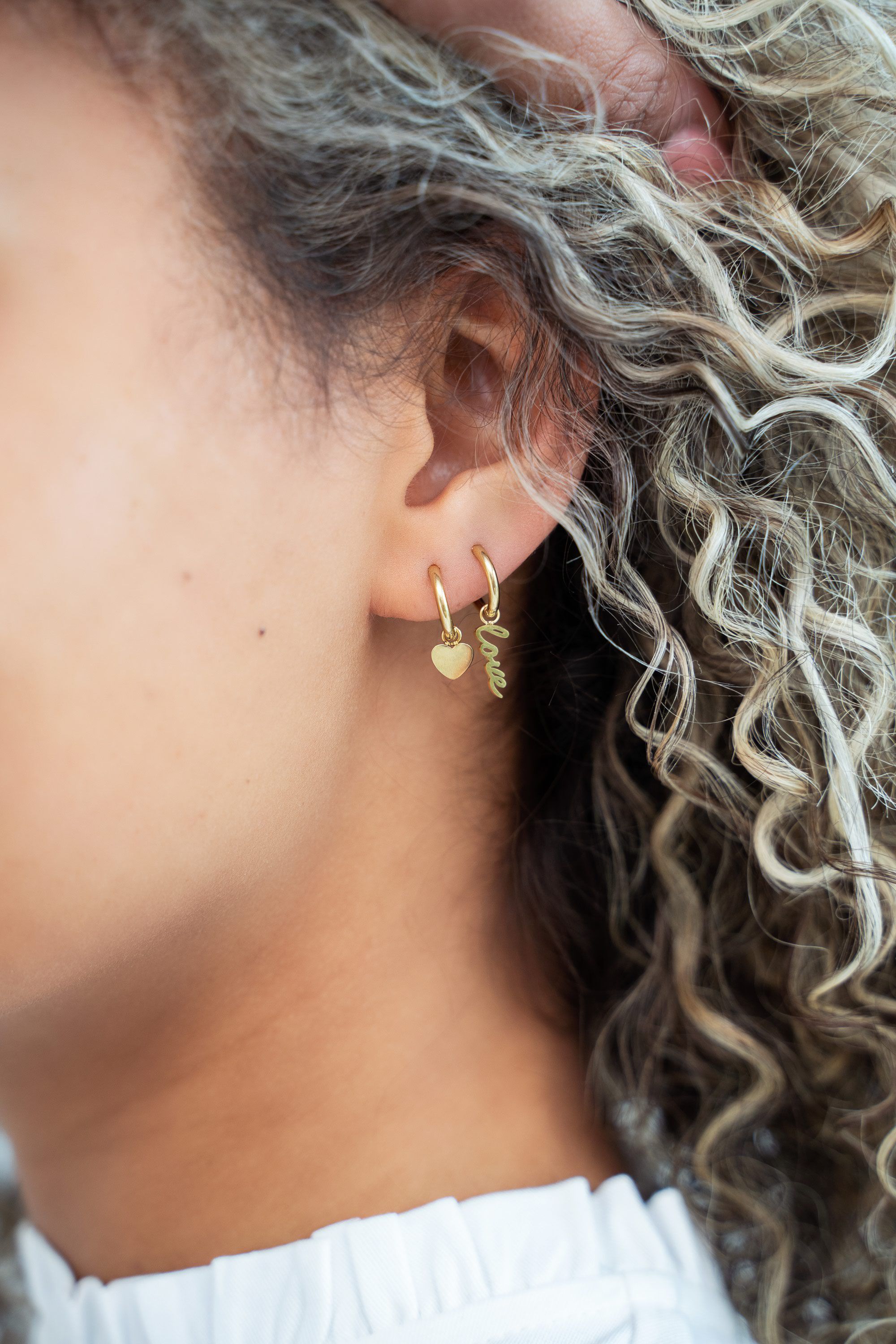 Small hoop earrings with heart charm