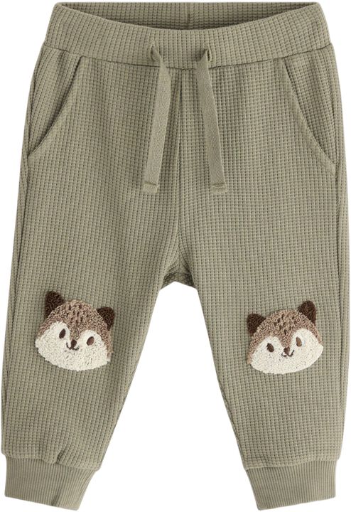 Joggers in waffled cotton with appl