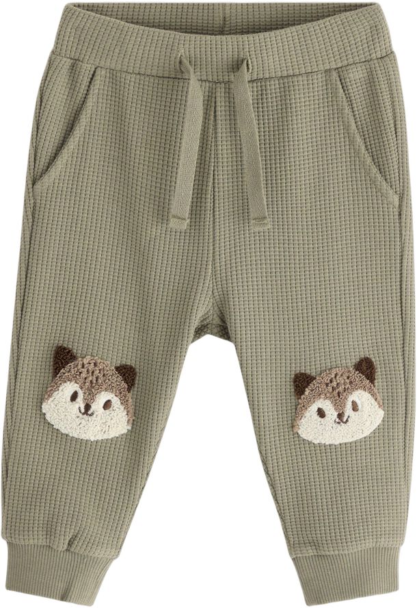 Joggers in waffled cotton with appl