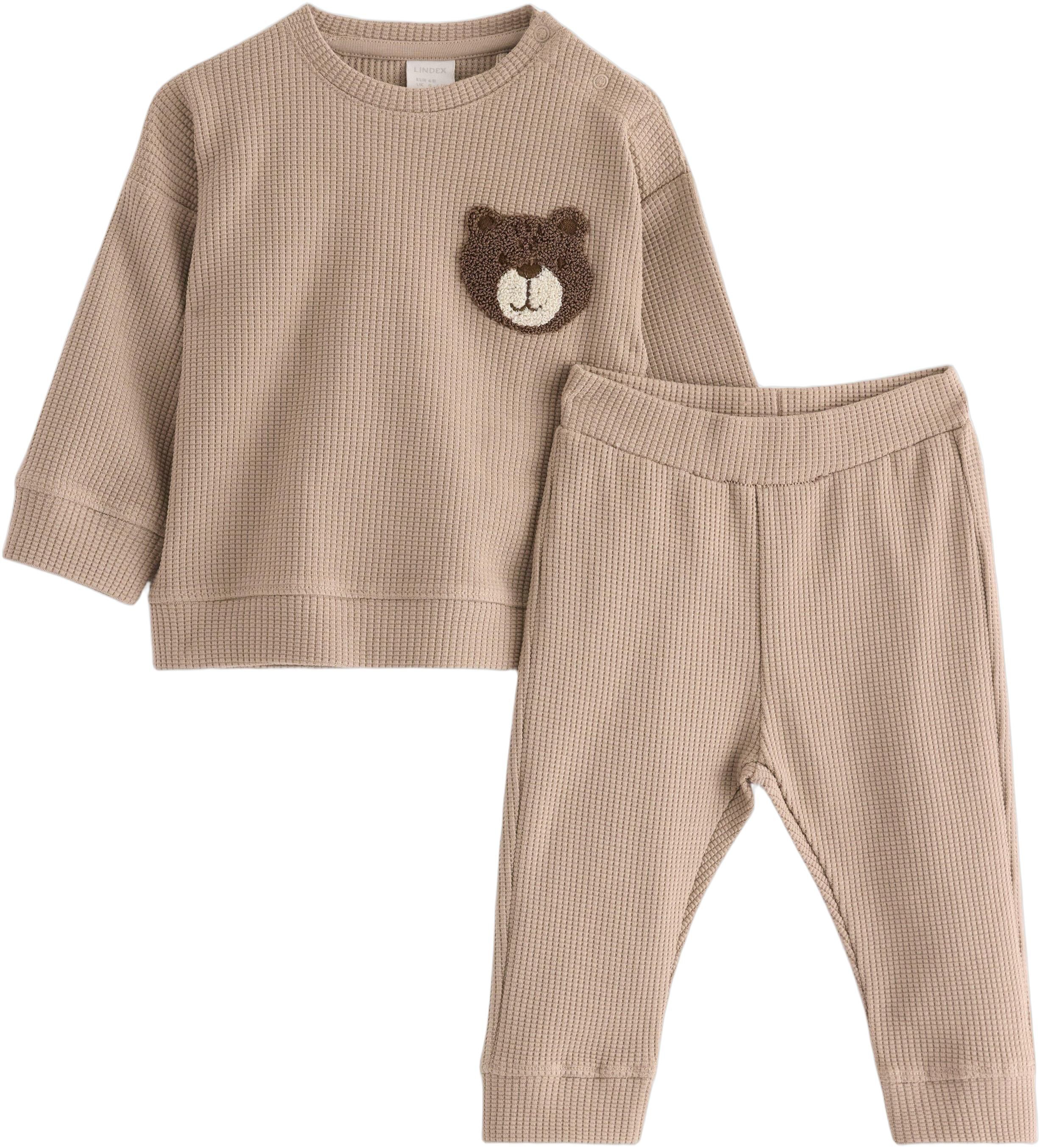 Set med v&aring;ffelstruktur och applika