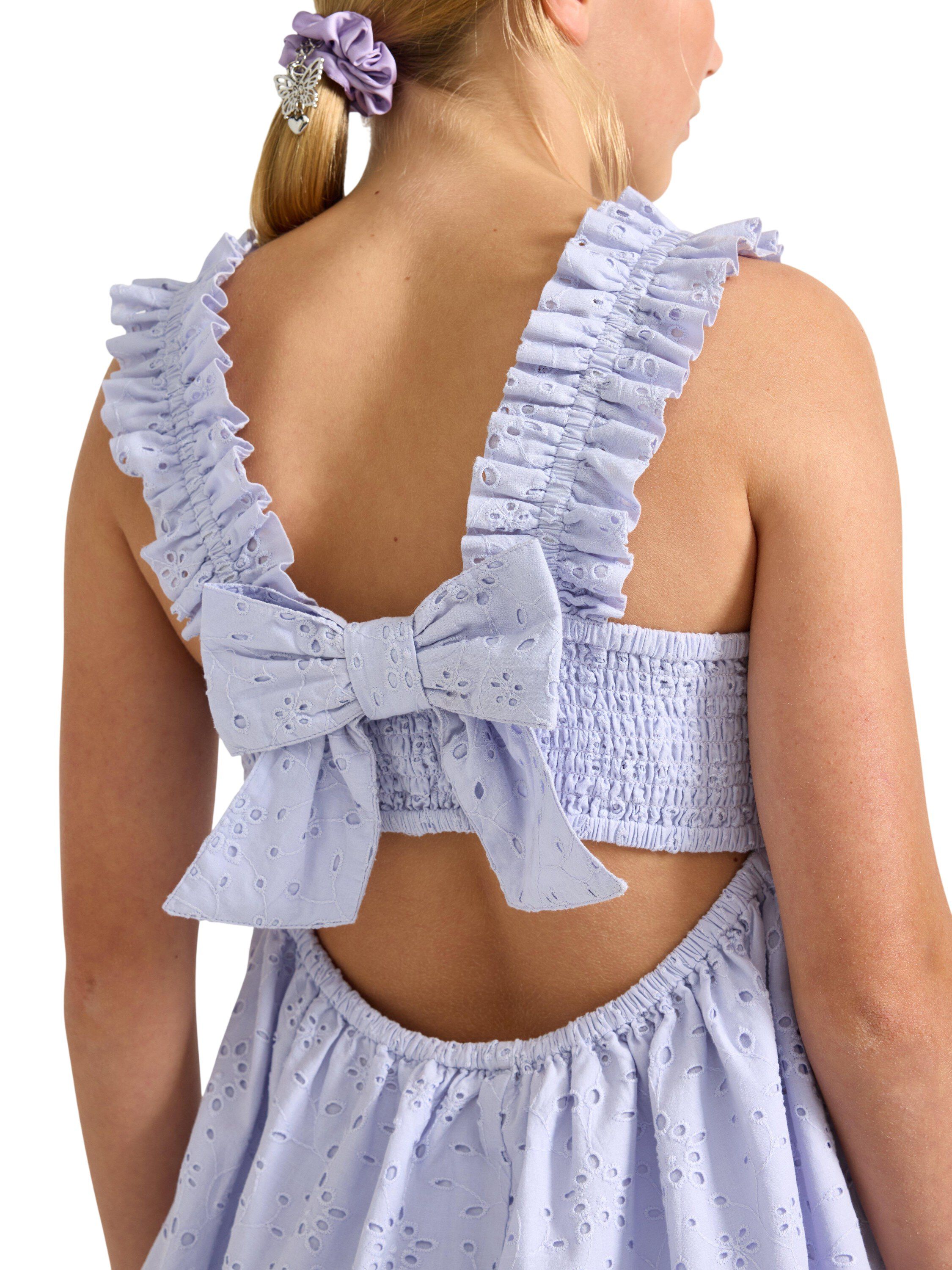 Sleeveless blouse with broderie ang