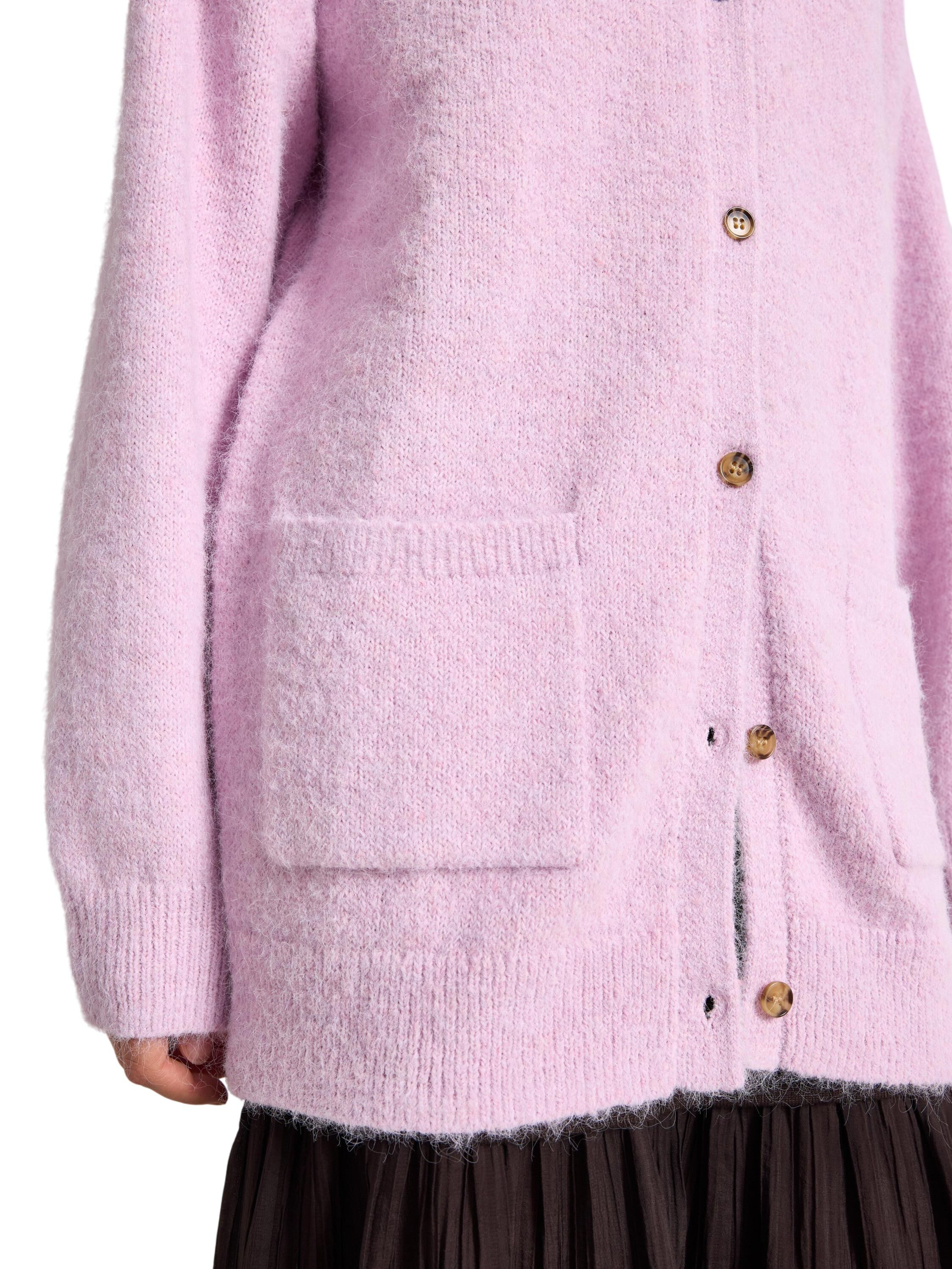 Knitted cardigan with a slightly lo