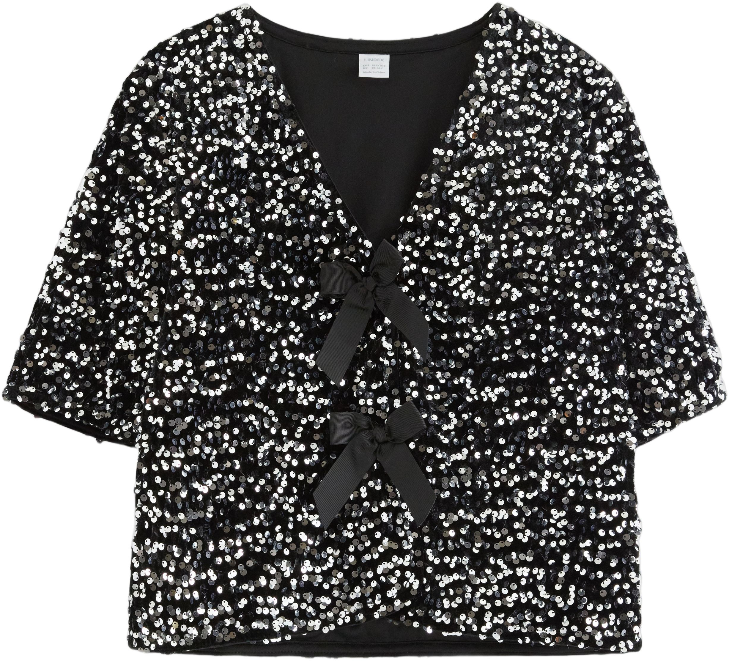 Kort&auml;rmad topp med paljetter och ro