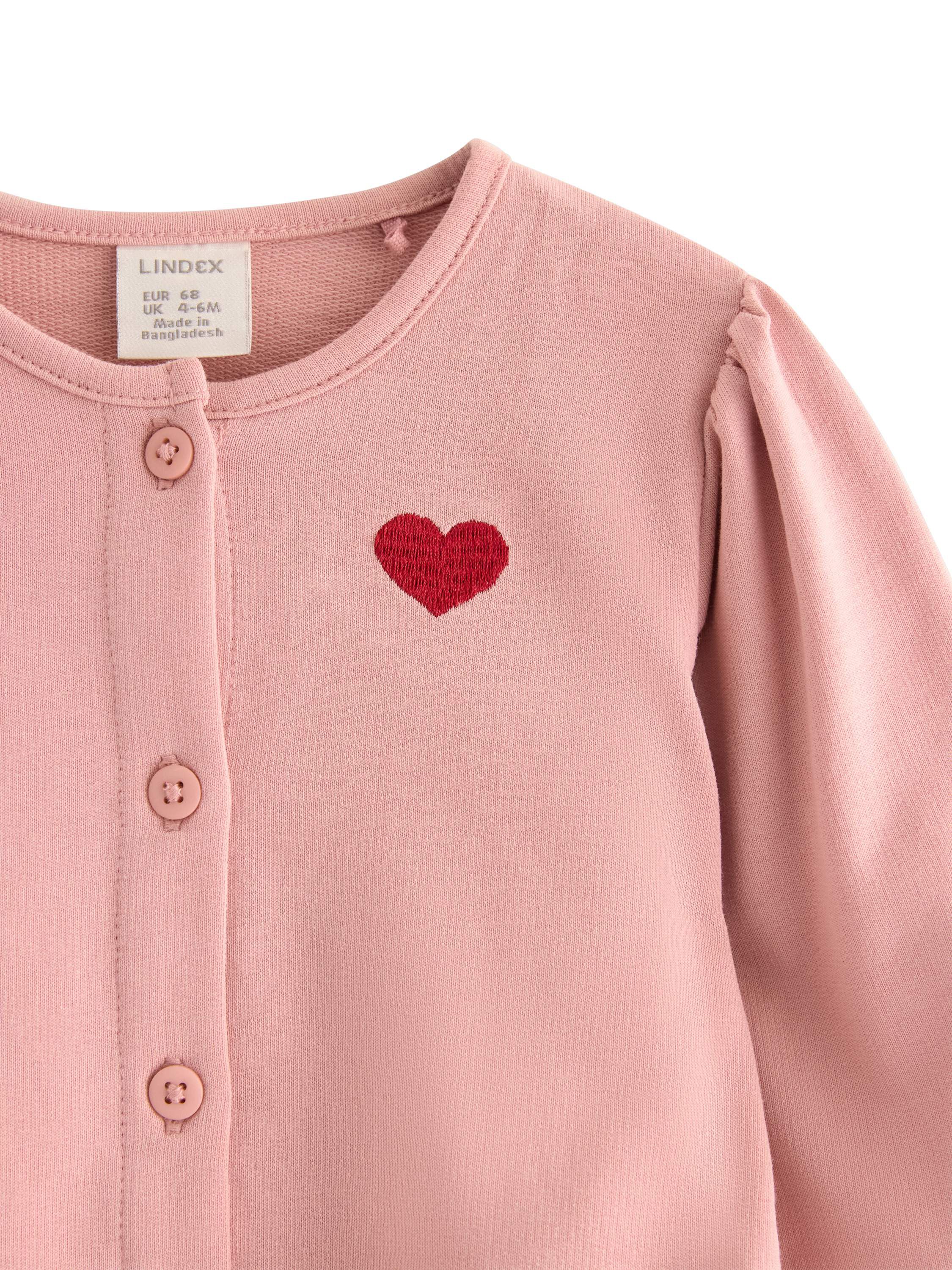 Myk cardigan i bomull med volangdet