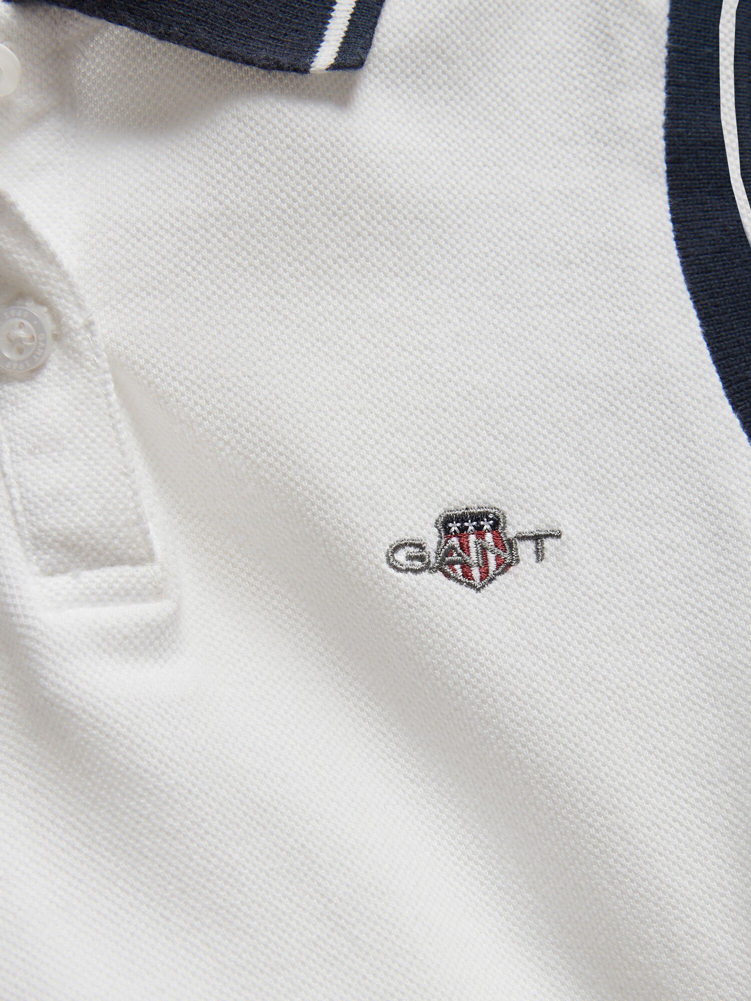 Shield Sleeveless Polo Top