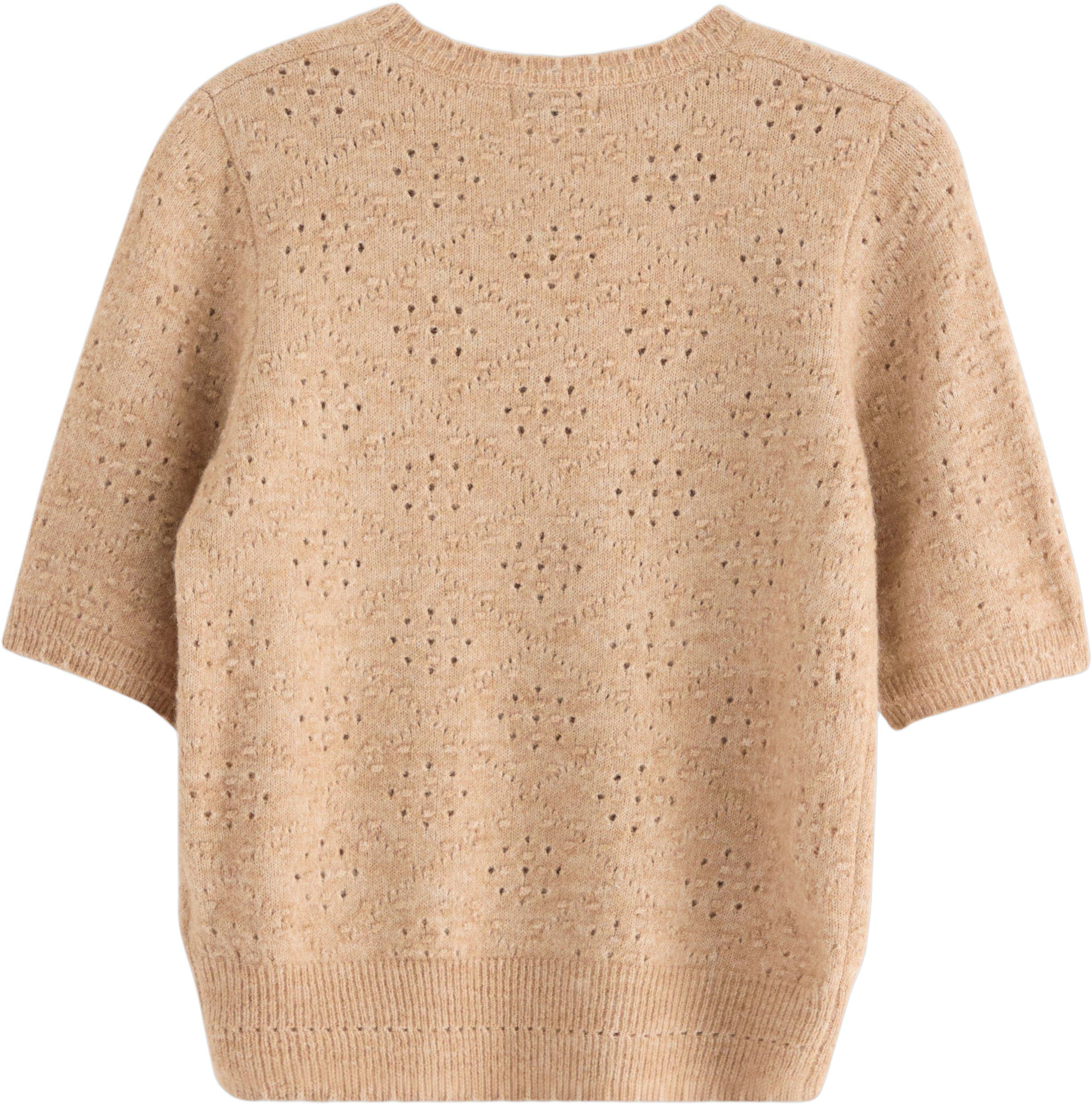 Mjuk, kort&auml;rmad tr&ouml;ja med ett hel